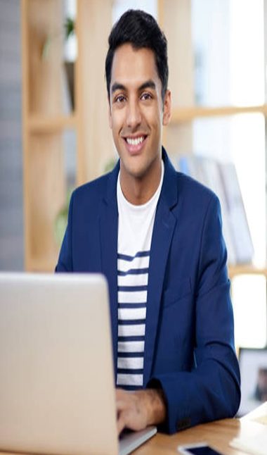 Portrait of a handsome young businessman working in an office